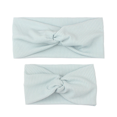Matching dusty rose ribbed knit headbands with a twisted knot, one for an adult and one for a child. - Image 6
