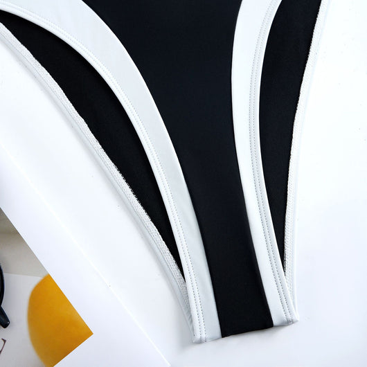 White one-piece women's swimsuit with black side panels and straps, featuring a ruched bust and U-shaped detail. - Image 35