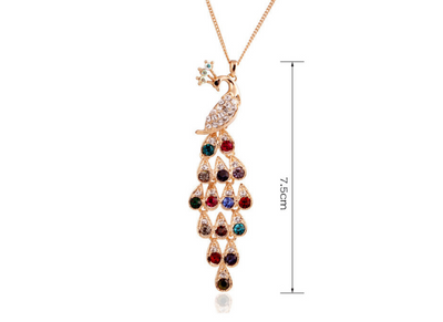 Gold tone peacock bridal jewelry set with colorful crystal accents, including a necklace, bracelet, and dangle earrings. - Image 7
