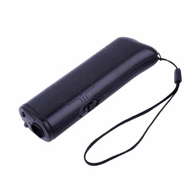 Black handheld ultrasonic dog repeller and trainer with a flashlight, featuring a slider switch and activation button. - Image 5