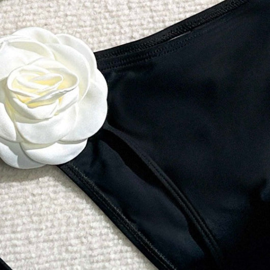 Black two-piece bikini with white 3D flower embellishments on the triangle top and tie-side bottom. - Image 4