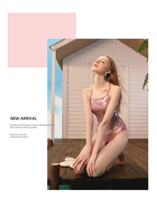 Woman wearing a shiny pink iridescent one-piece swimsuit with thin straps, ideal for racing or surfing. - Image 12