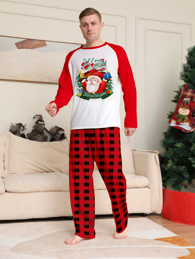 Man in a red and white Christmas pajama set with a Santa Claus graphic top and red and black plaid pants. - Image 8