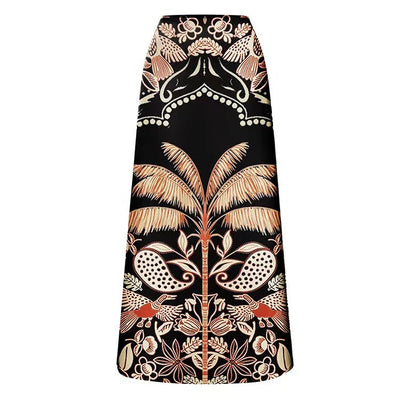 Black one-piece swimsuit with an asymmetrical top and matching long skirt, featuring a tropical palm tree and bird print. - Image 13