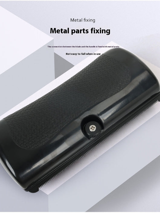 Black HistoTree animal deshedding comb with a textured grip, shown next to its white and green retail box. - Image 7