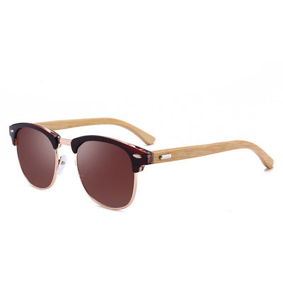 Clubmaster sunglasses with black upper frames, gold-tone metal lower rims, blue mirrored lenses, and light wood-look temples. - Image 13