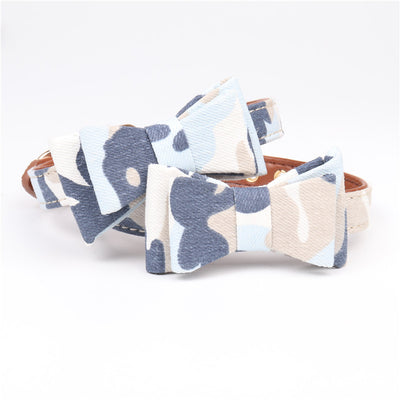 Two pet collars with blue, white, and tan camouflage bowknots and brown lining on a white background. - Image 5
