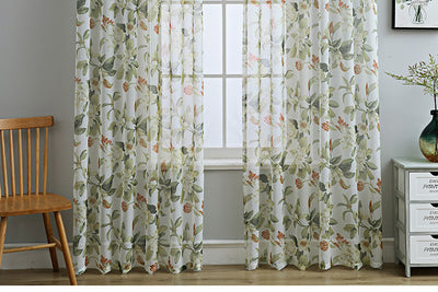 Dark gray semi-sheer curtains with a white and green floral pattern, hung on a black rod in a living room. - Image 16