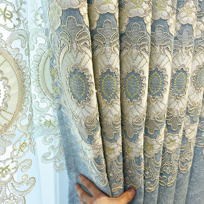 Blue sheer curtain with intricate gold and dark blue embroidery in a European classical style, draped over a window. - Image 2