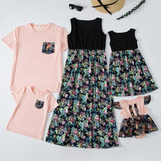 Family matching outfits including a peach and floral maxi dress, two short-sleeve shirts, a sleeveless dress, and a baby romper.