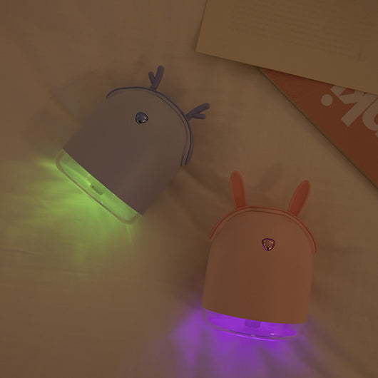 Yellow smart humidifier with cute animal ears and a gold emblem, featuring a transparent base for small spaces. - Image 5