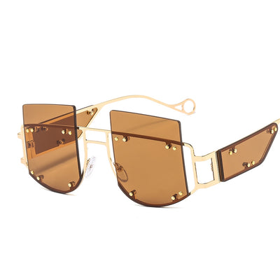 Red oversized rimless sunglasses with a unique geometric design and gold-tone metal temples. - Image 10
