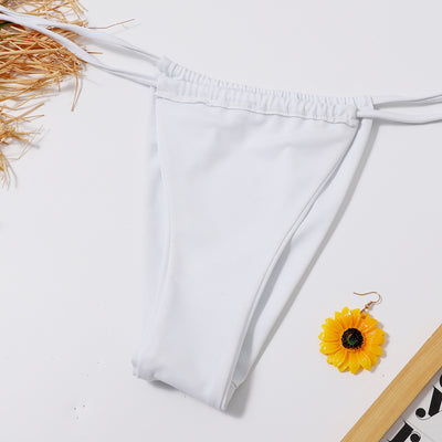 White two-piece underwire swimsuit with a front tie bikini top and adjustable string bottoms, displayed flat. - Image 11