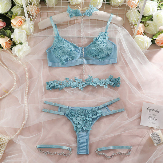 Light blue lace lingerie set with floral details, including a bra, thong, garter belt, choker, and leg chains. - Image 19