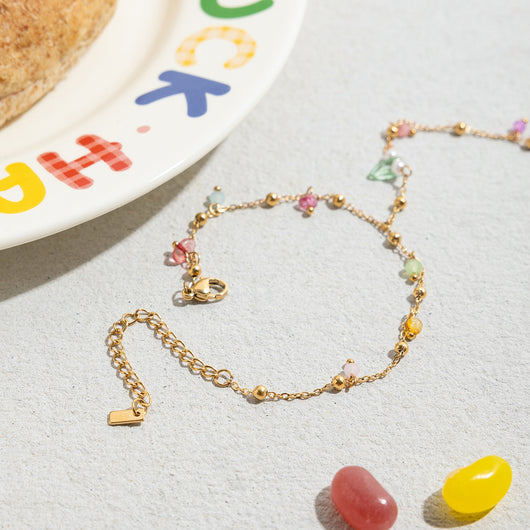 Gold-colored bracelet with a chain of small, interconnected heart-shaped links, featuring a lobster clasp and extender. - Image 11