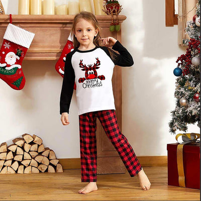 Family matching Christmas pajamas with a deer graphic and "Merry Christmas" text on white and black tops, paired with red and black buffalo plaid pants. - Image 9