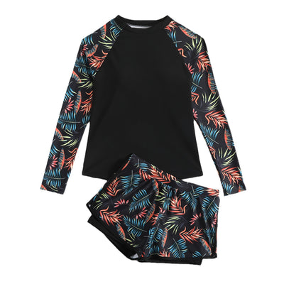 Women's long-sleeve tankini swimsuit with black top and blue tropical leaf print raglan sleeves, matching swim shorts. - Image 5