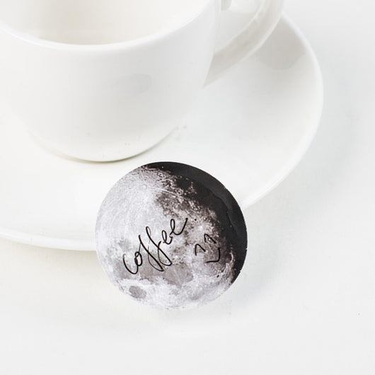 Circular black and white stickers depicting various moon phases, with a small black sticker box on a white background. - Image 3