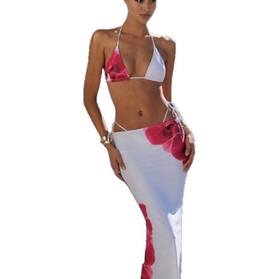 White and pink floral print three-piece bikini swimsuit with a halter top, tie-side bottom, and long maxi skirt. - Image 5