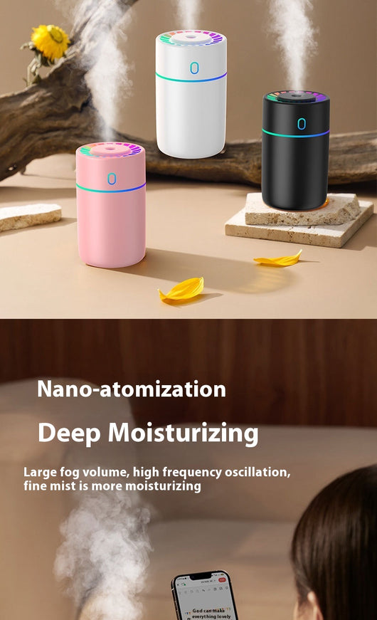 Pink cylindrical humidifier with a colorful LED light ring on top and a blue-green light band around its middle. - Image 11