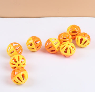 Five colorful plastic pet bell balls in red, yellow/orange, lime green, and hot pink, with hollow designs. - Image 10