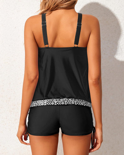 Women's two-piece tankini swimsuit with a colorful abstract print tank top and solid black ruched swim shorts. - Image 33