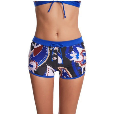 Women's flat-angle printed high-waist bikini with a halter top and shorts in blue, white, red, and black. - Image 4