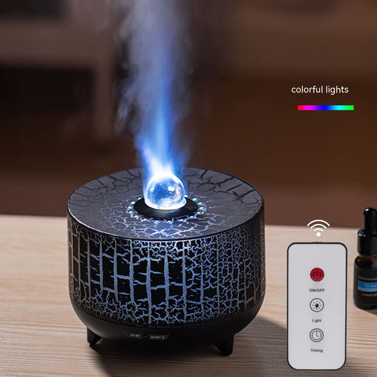 Black cylindrical aromatherapy diffuser with a crackle pattern, clear spherical top, and control buttons for timer and light.