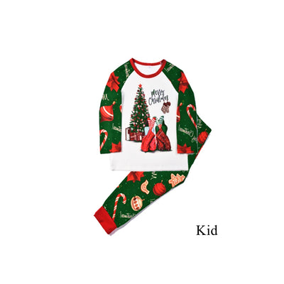 Green baby Christmas pajama romper with red trim, featuring candy canes, ornaments, gingerbread men, and poinsettias. - Image 12