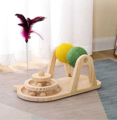 Solid wood cat toy with a tiered ball track, a spring-loaded feather wand, and green and yellow sisal rollers. - Image 10