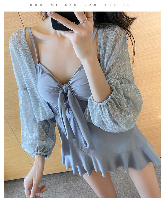 Women's light blue one-piece swimsuit with tie-front bust and ruffled hem, paired with a sheer shimmery cover-up. - Image 10