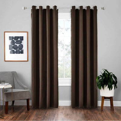 Light gray polyester blackout curtains with grommet tops hanging on a white rod in a modern living room. - Image 10