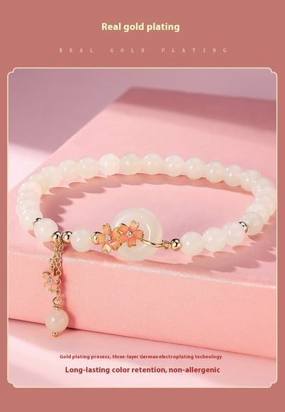 Joya de Jade Hetian con Plata 925 - Diseño Flor de Cerezo Estilo Mori Elegante - Image 12
