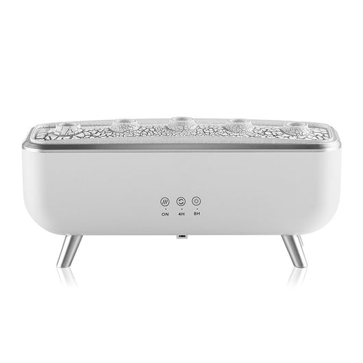 White rectangular ultrasonic humidifier with a textured top, silver legs, and control icons for mist, rotation, and light. - Image 5
