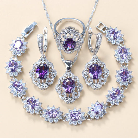 Four-piece jewelry set with silver-tone settings, featuring oval purple cubic zirconia stones surrounded by clear accents. - Image 21