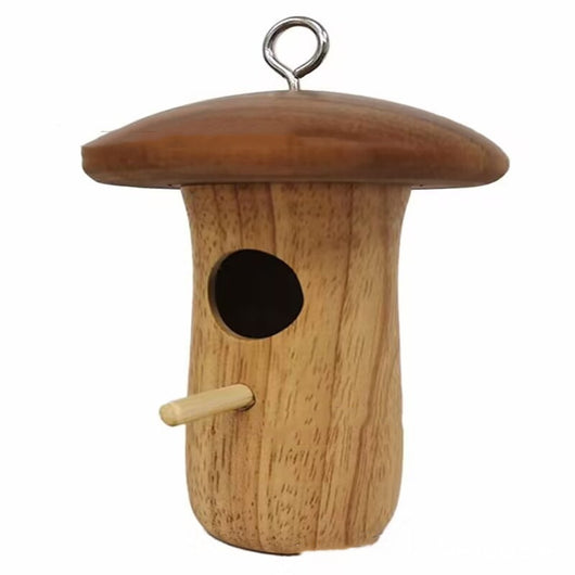 Wooden mushroom-shaped hummingbird feeder with a dark brown cap and light wood body, featuring an entrance hole and perch, held in a hand outdoors. - Image 10