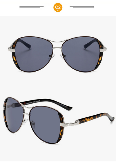 Women's large frame fashionable sunglasses with gradient gray lenses, silver-tone metal frames, and white arms. - Image 15