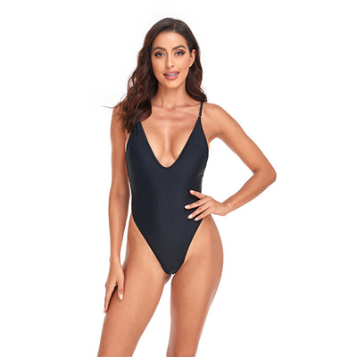 Dark brown one-piece swimsuit with a deep V-neckline and thin adjustable straps, styled with a straw hat and sunglasses. - Image 17