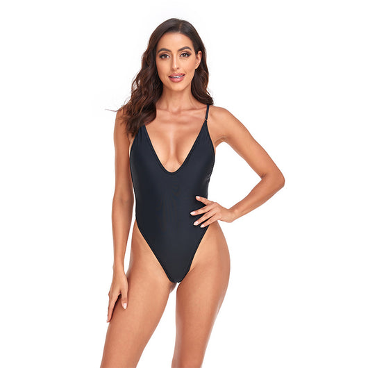Dark brown one-piece swimsuit with a deep V-neckline and thin adjustable straps, styled with a straw hat and sunglasses. - Image 17