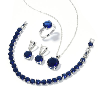 Four-piece jewelry set with silver-toned metal and round deep pink gemstones, including a necklace, bracelet, ring, and earrings. - Image 10