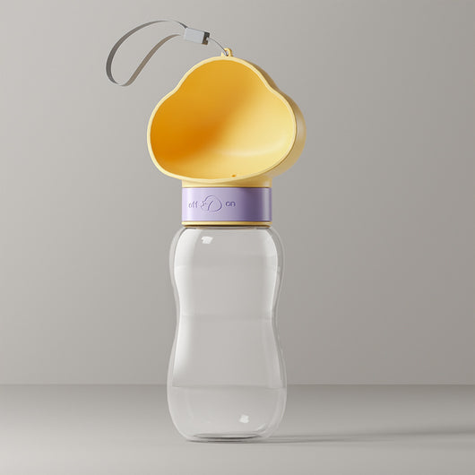 Yellow and clear portable pet water bottle with integrated drinking bowl and separate food container for walking dogs. - Image 10