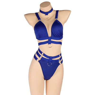 Woman wearing a royal blue strappy lingerie set with O-rings, including a bra, high-waisted bottoms, and a choker. - Image 28
