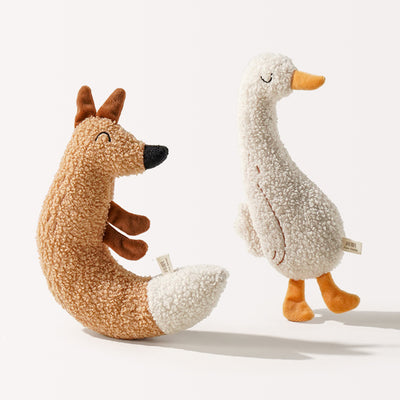 C-shaped plush fox pet toy with textured brown body, white tail tip, and embroidered face, measuring 23.5cm tall.