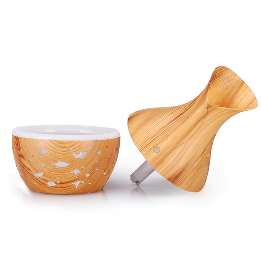 Dark wood grain humidifier shaped like a vase, with glowing green animal cutouts and mist emitting from the top. - Image 6
