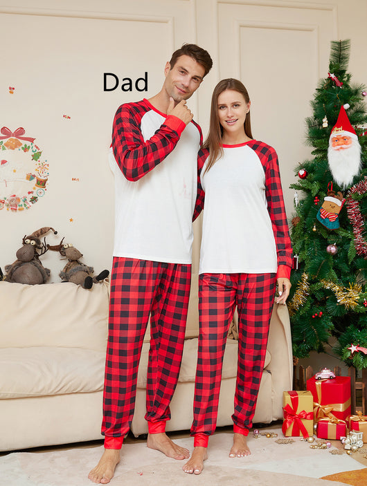 Woman wearing a red and black plaid Christmas pajama set with a white raglan long-sleeve top and matching pants. - Image 5