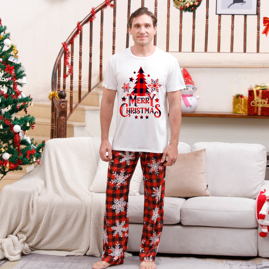 Family of five wearing matching Christmas pajamas with white 'Cousin Crew' tops and red plaid snowflake pants. - Image 6