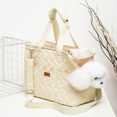 Cream quilted portable pet carrier with top handles, detachable shoulder strap, front pocket, and ventilation mesh. - Image 4