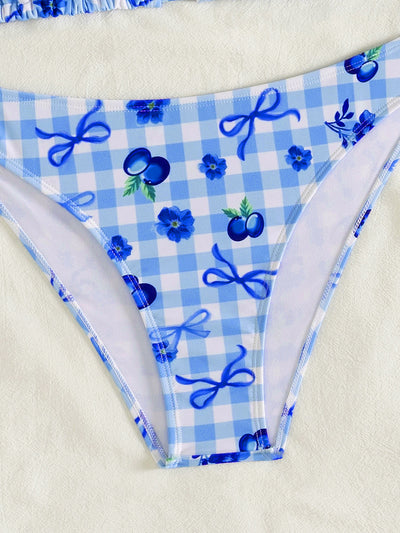 Resort-style blue and white gingham bikini set with blueberry and bow print, featuring a halter triangle top and high-cut bottoms. - Image 13