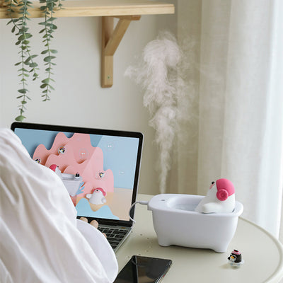 Creative air humidifier shaped like a white bathtub with a polar bear wearing pink earmuffs and a small penguin. - Image 12
