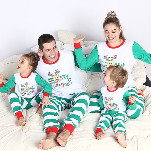 Family of four wearing matching white and green striped Christmas pajamas with reindeer and "Merry Christmas" text. - Image 12